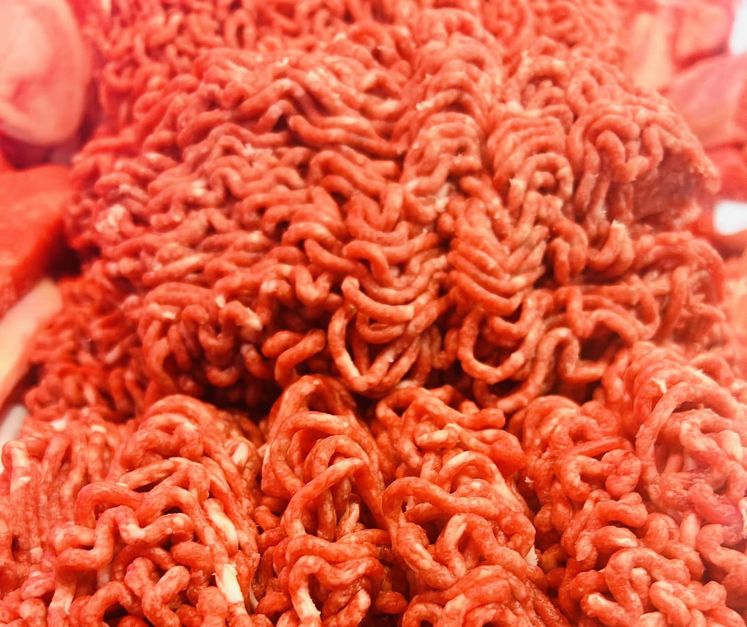 Close-up of freshly ground beef in the butcher case