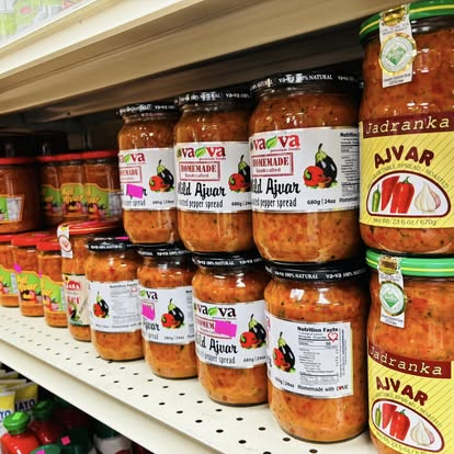 Shelf of imported ajvar — mild and homemade red pepper spreads