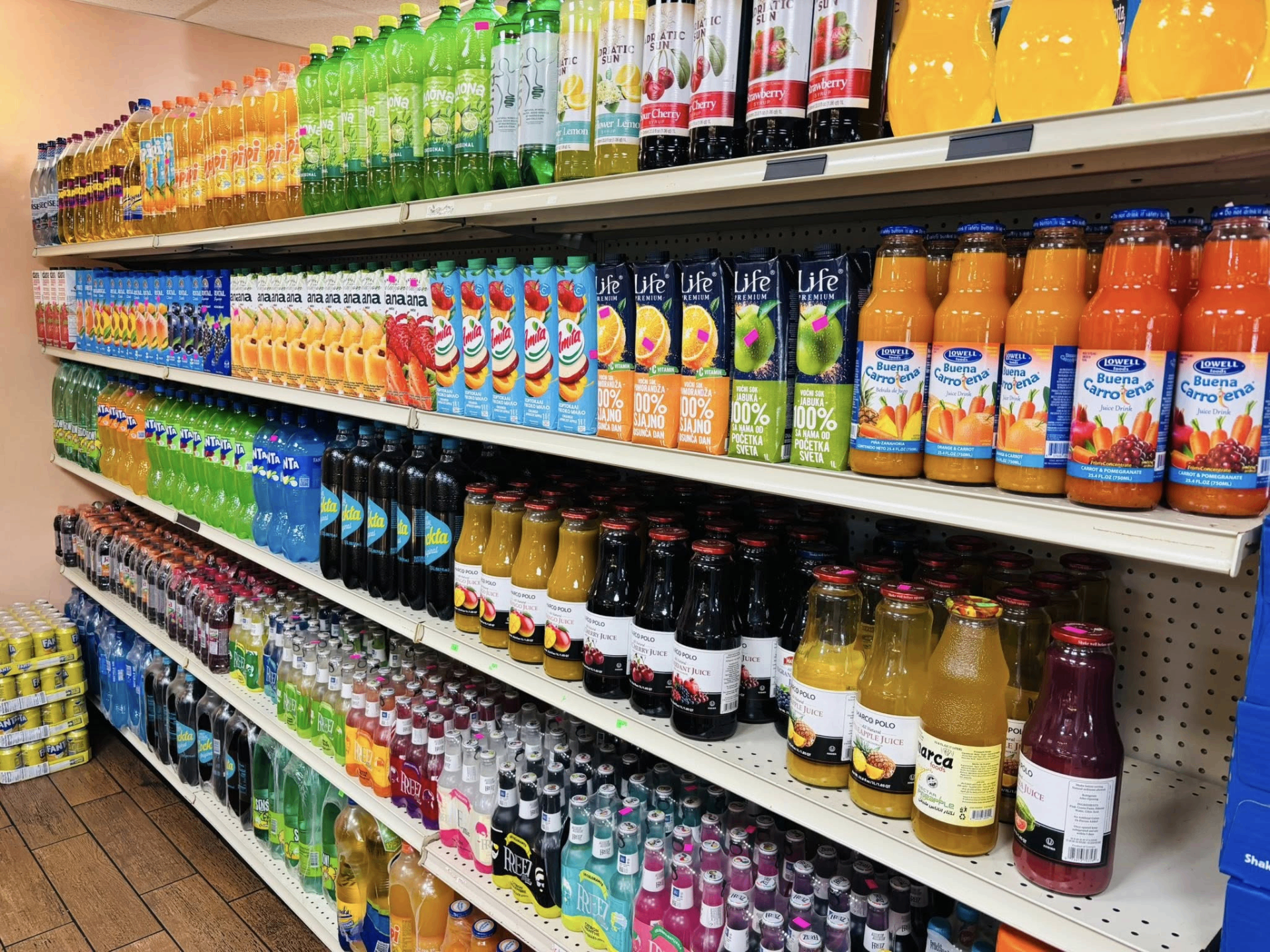 Aisle of imported European juices, syrups and sodas on the shelves